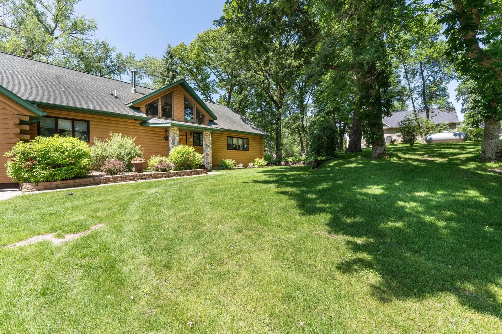 large Back yard with shrubs, perennials and