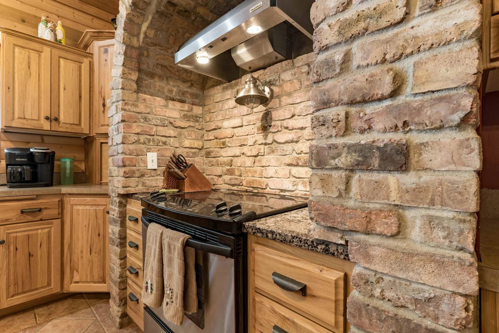 brick hearth with exhaust fan and lighting.