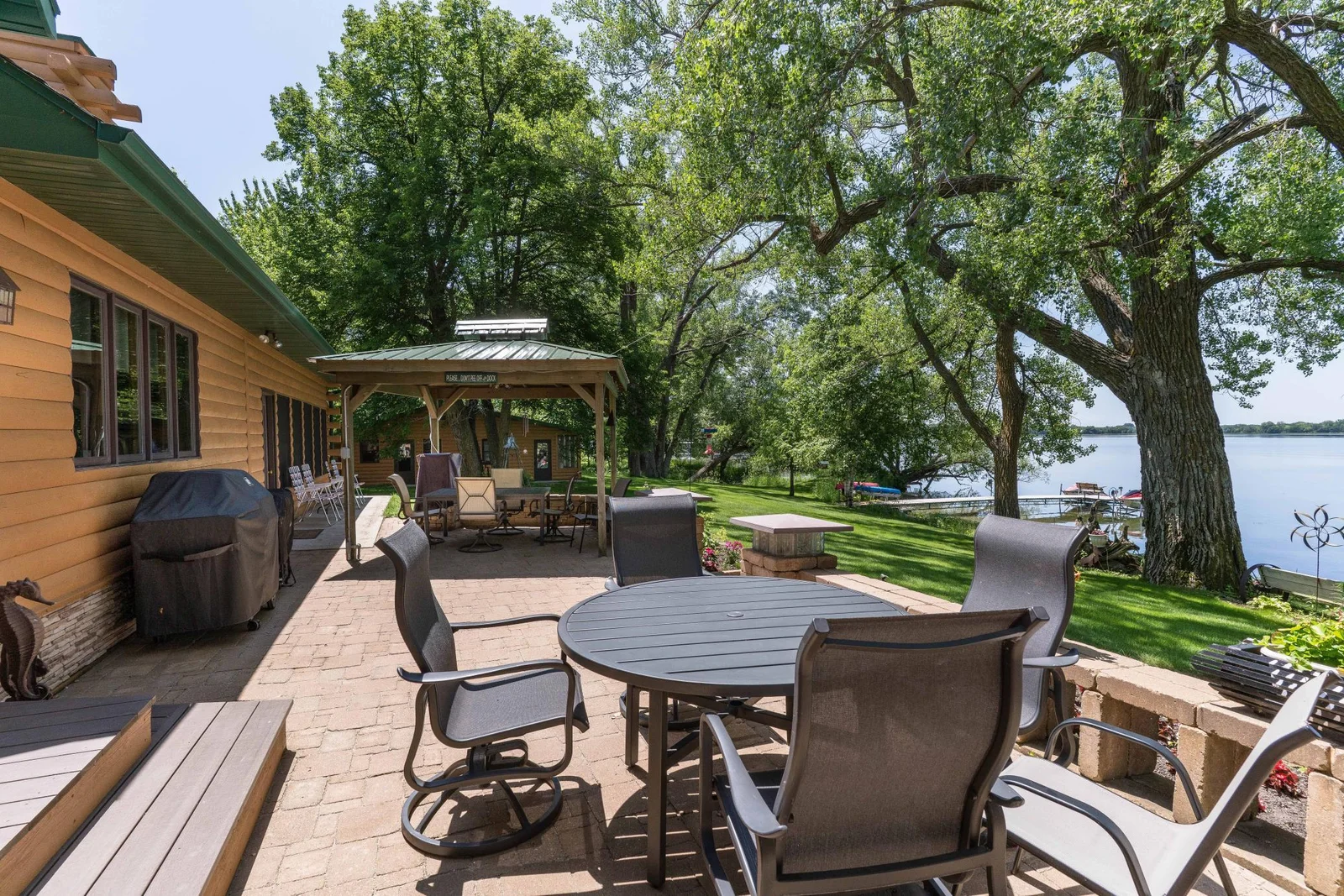 Large Lake side Paver Patio with Pergola. Panoramic Views  with Awesome sunsets!
