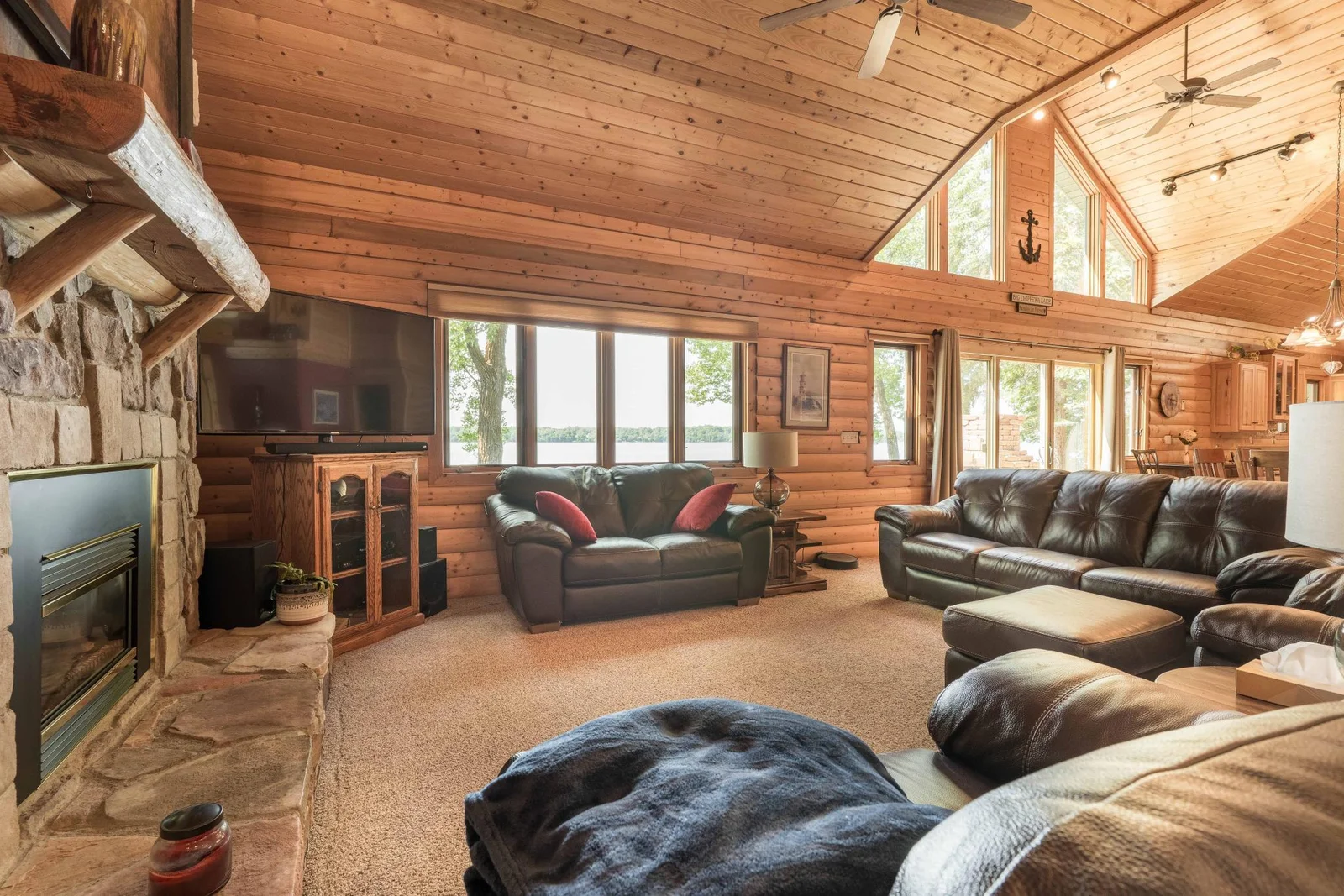 living room with lots of windows for lakeside views.