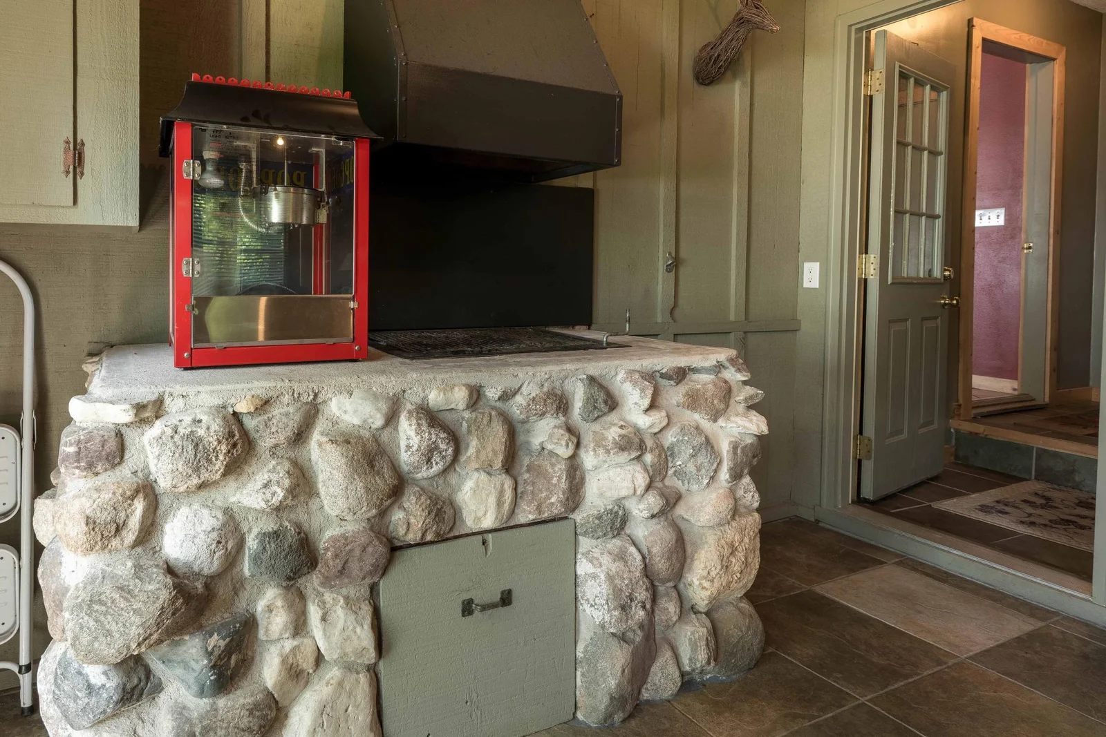 3 Season porch complete with Grill Station.