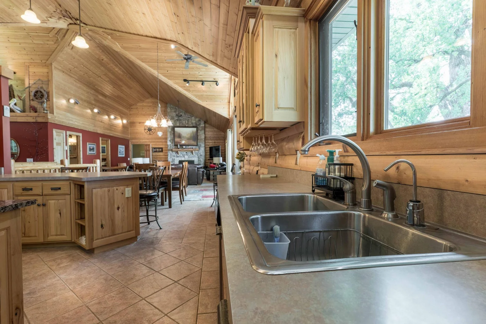 Stainless steel sink with windows and lighting.
