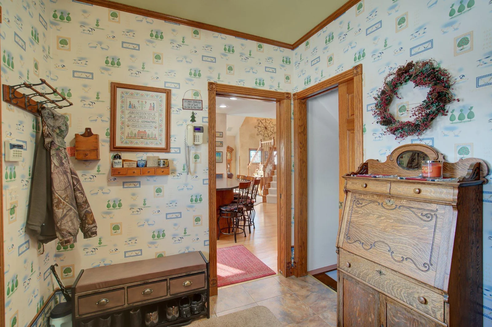 Side Foyer with stairwell to lower level amusement/games room and family room