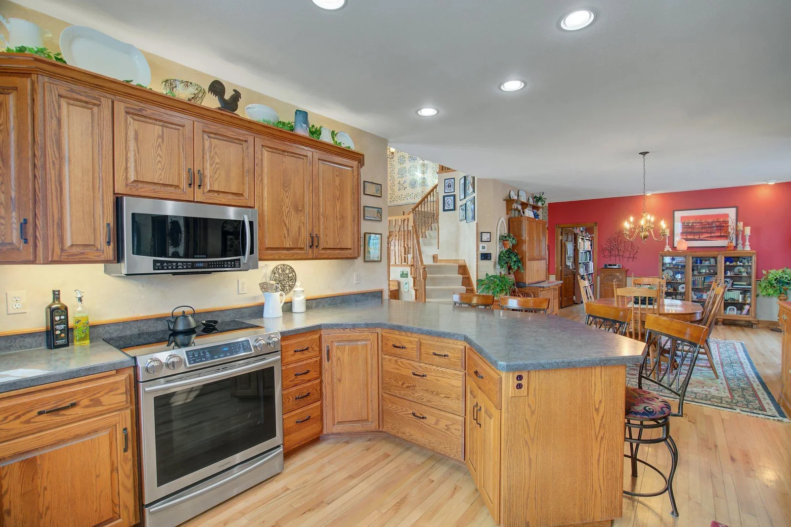 Custom Kitchen with solid wood custom cabinetry and eat-in peninsula bar