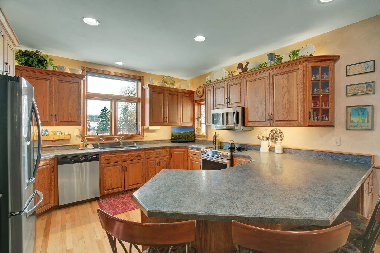 Custom Kitchen with solid wood custom cabinetry and eat-in peninsula bar
