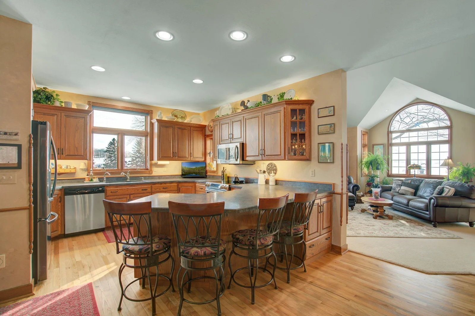 Custom Kitchen with solid wood custom cabinetry and eat-in peninsula bar