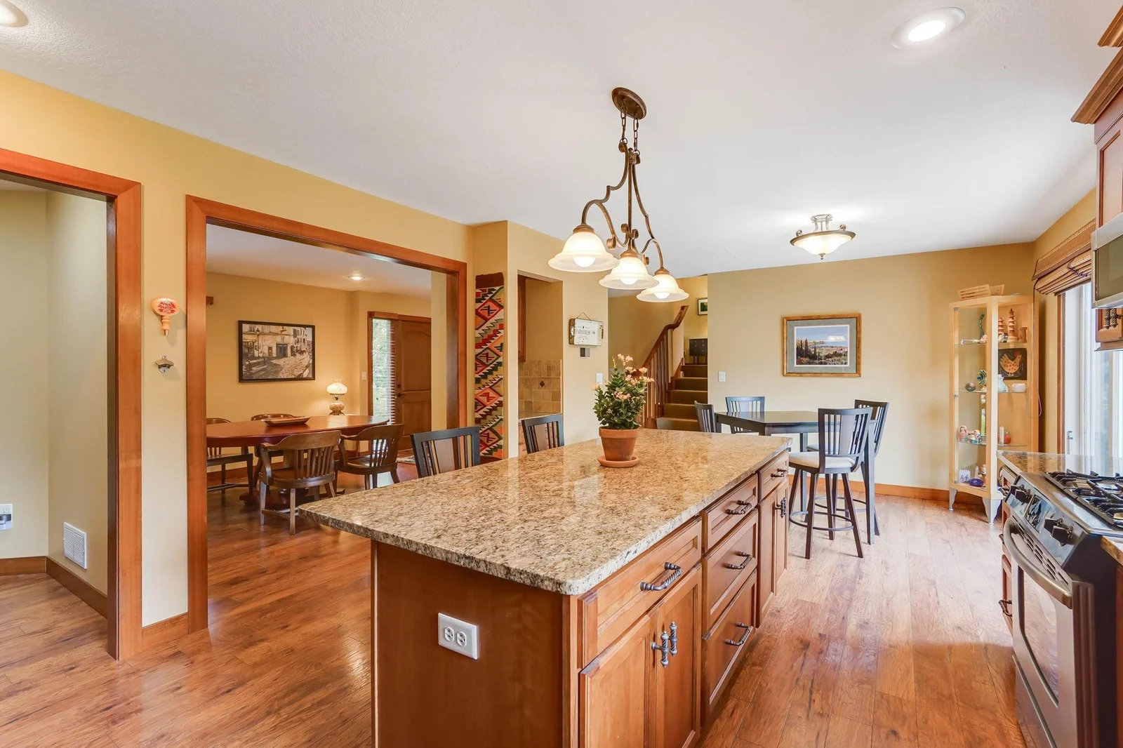 Note how the doorways are wood trimed. Gas range, pantry with roll out shelves, and large dinette area.