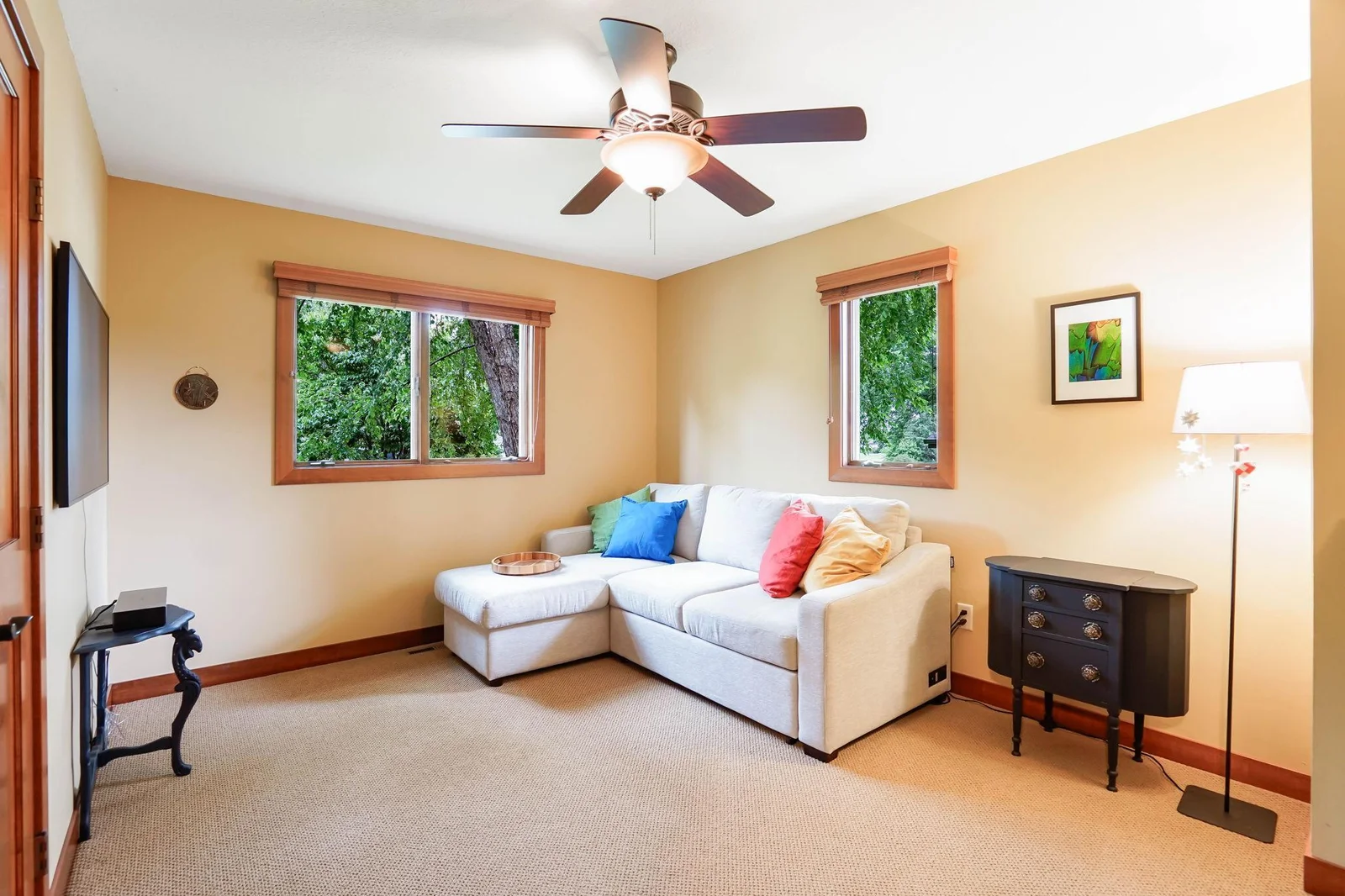 The second upper bedroom with Anderson windows and ceiling fan.  Most windows include custom wood blinds.