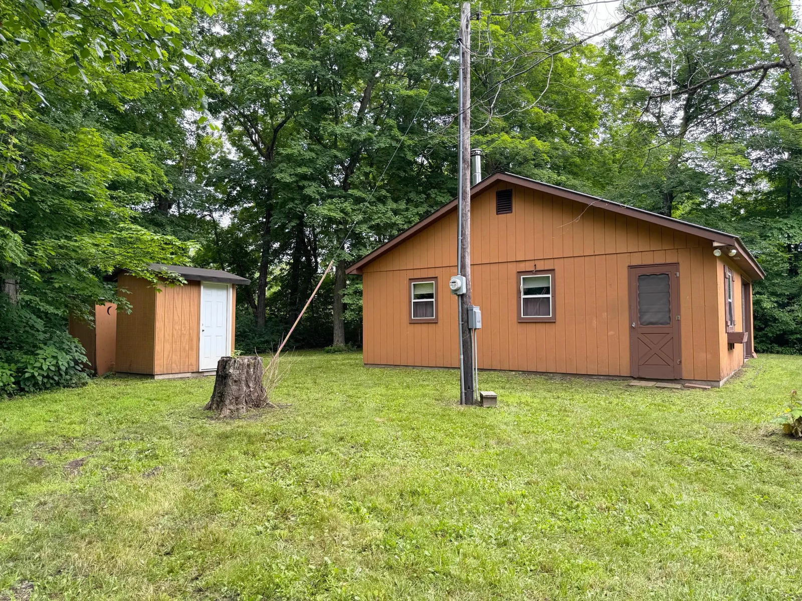More views of the bunkhouse with the outhouses to the left.