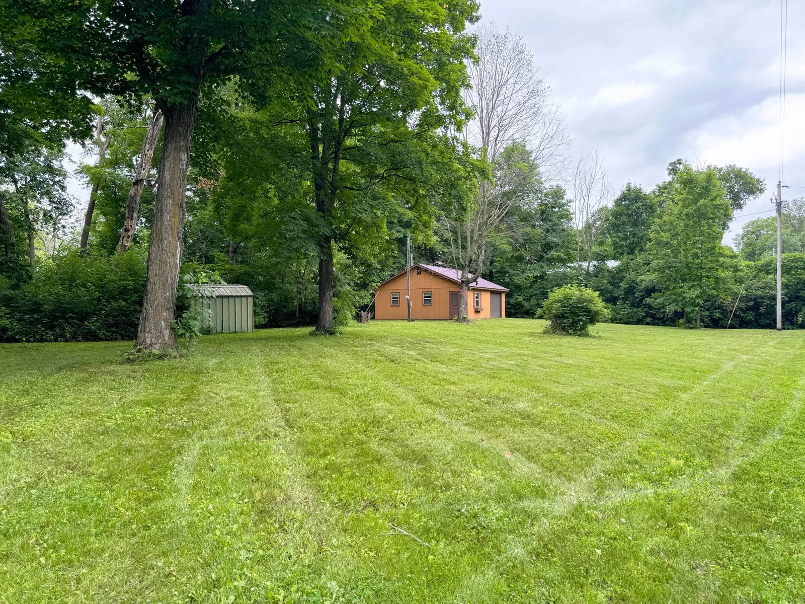 Looking across the expansive lawn towards the bunkhouse.