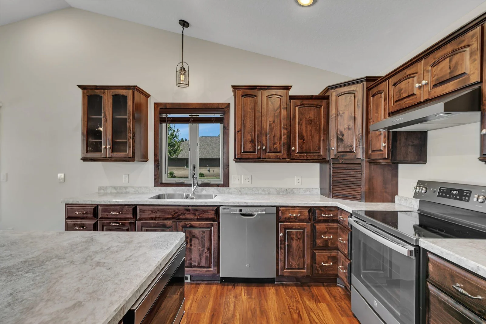 Kitchen with custom knotty alder cabinets