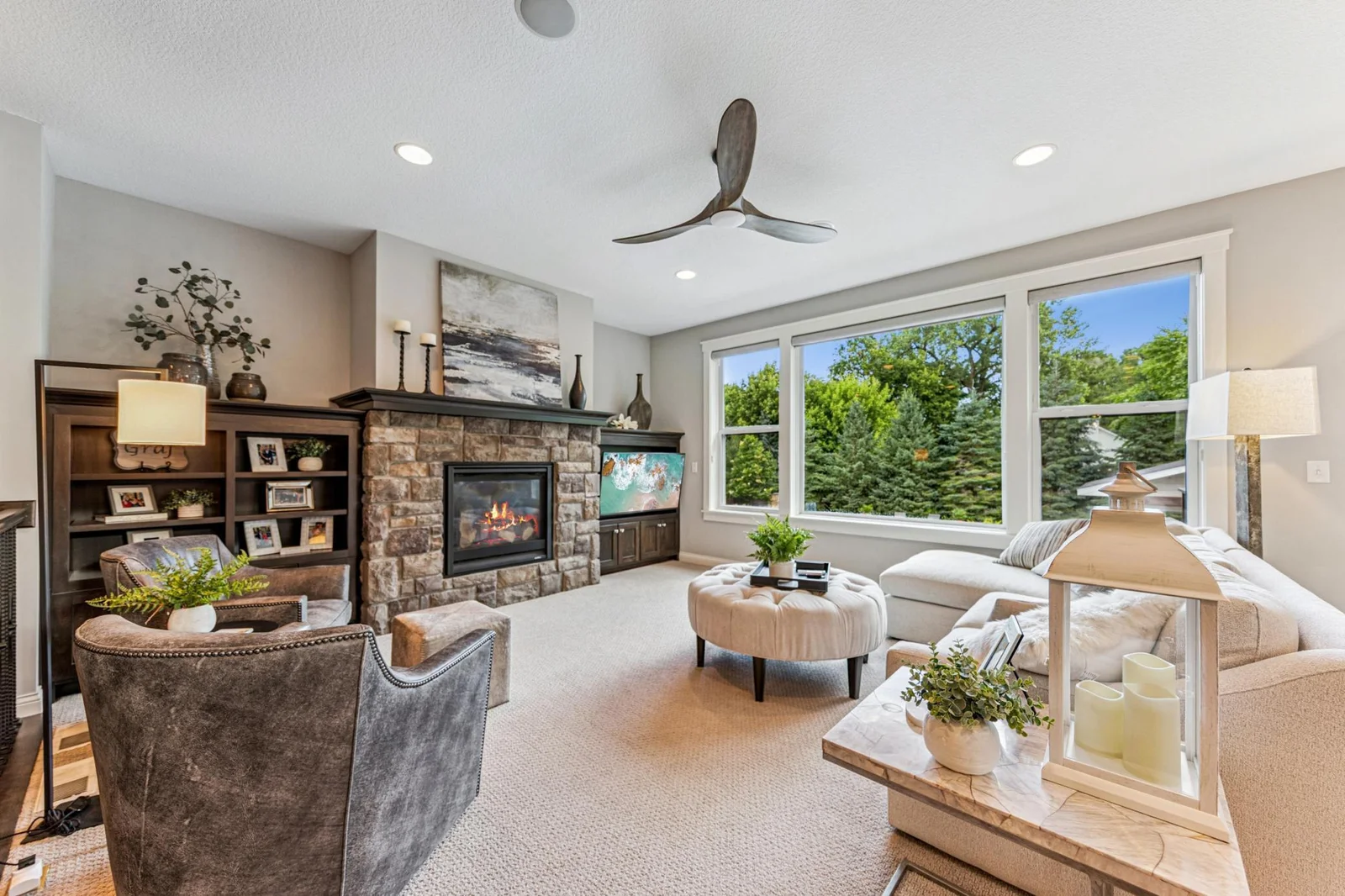 Sun-filled great room with large windows.