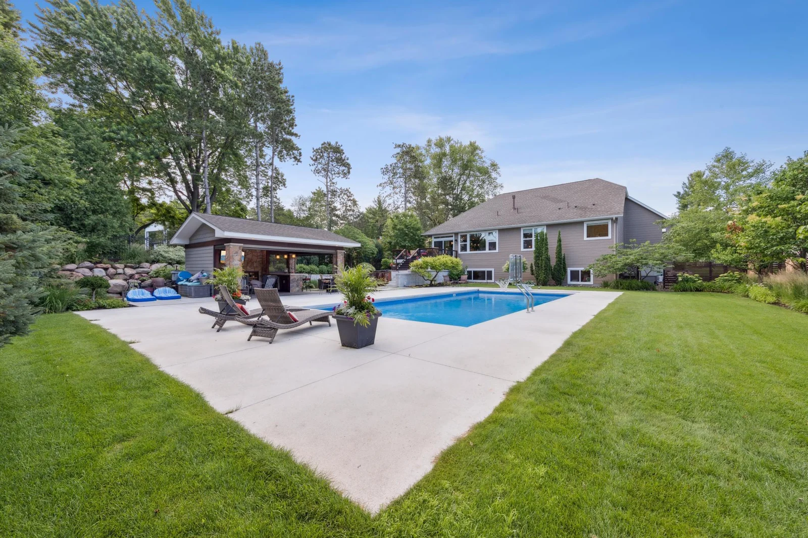 Enjoy a wonderfully landscaped property with a spacious yard and a gorgeous pool, perfect for entertaining.