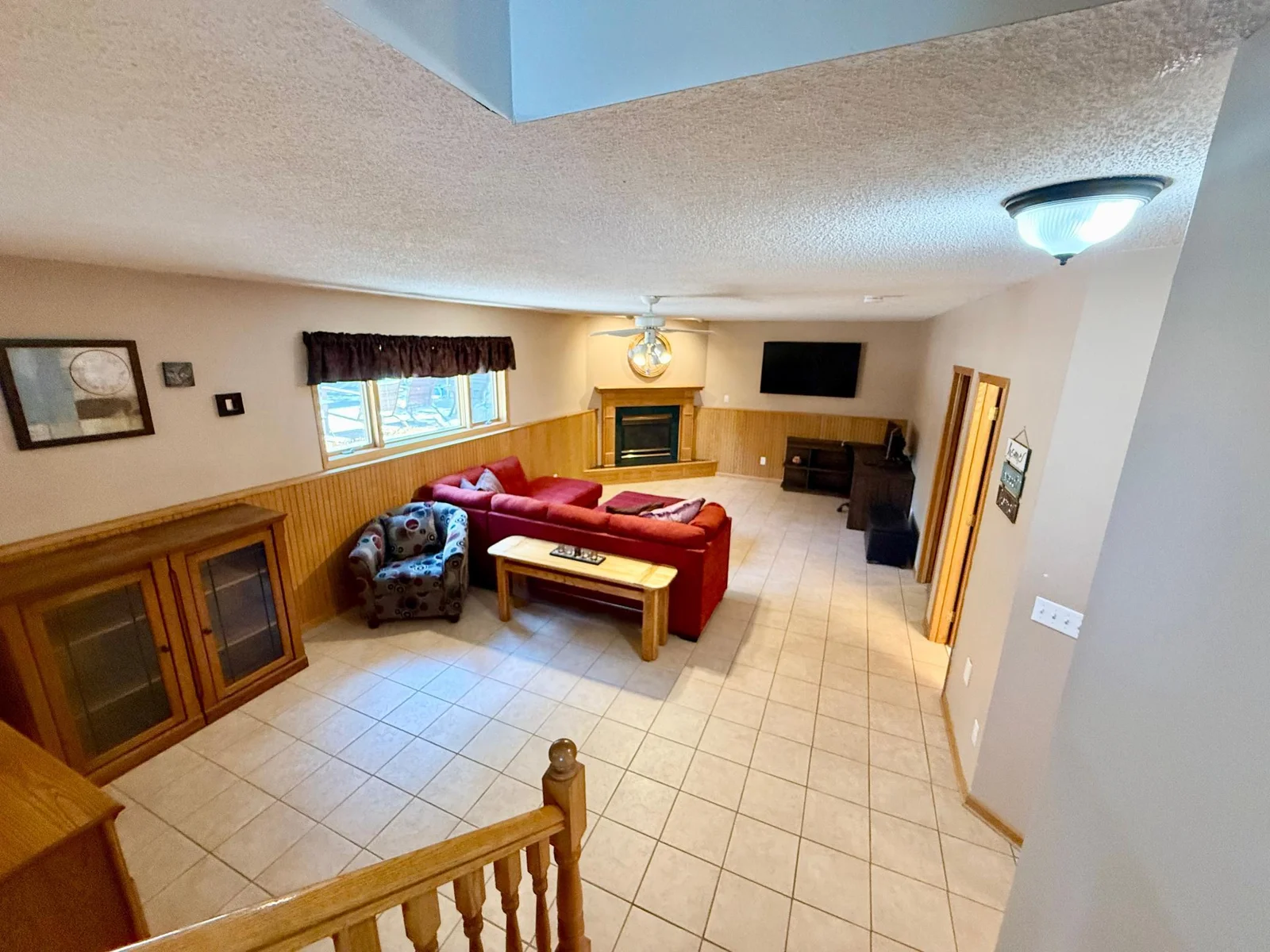 Garden level family room offers a beautiful view of the outdoor pool and patio.