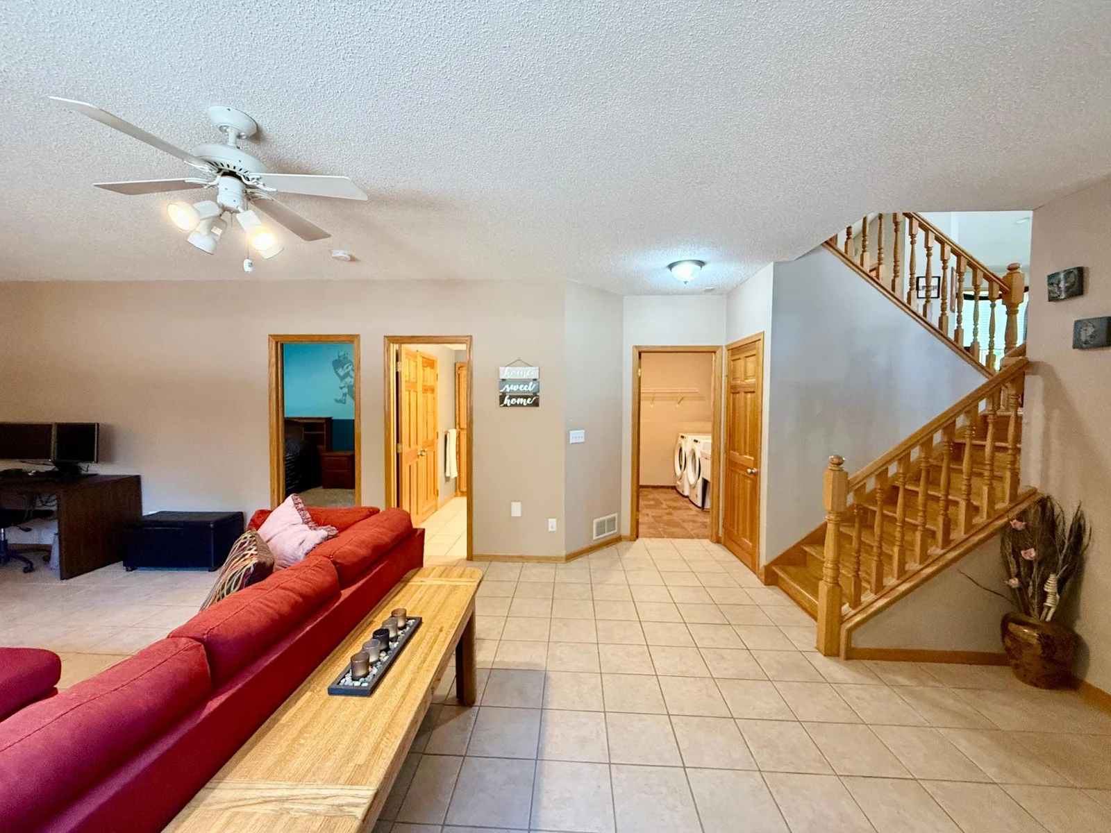Bedroom #4 with a walk-thru full bathroom and laundry room are also located on the garden level.