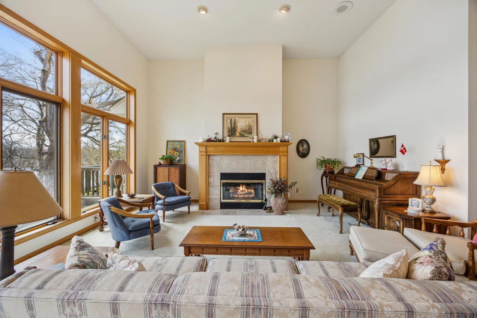 Great room with gas fireplace with 13 feet ceilings.