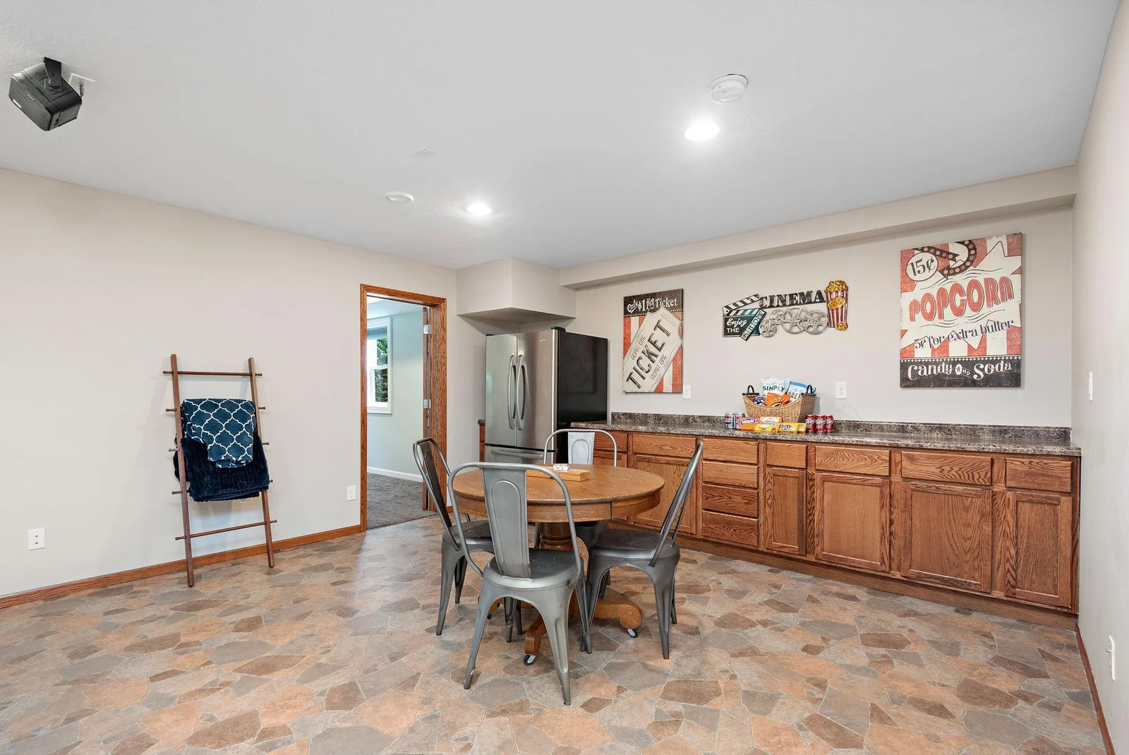 Large family/recreation room with countertops and cabinets with rough-in for your future bar area!