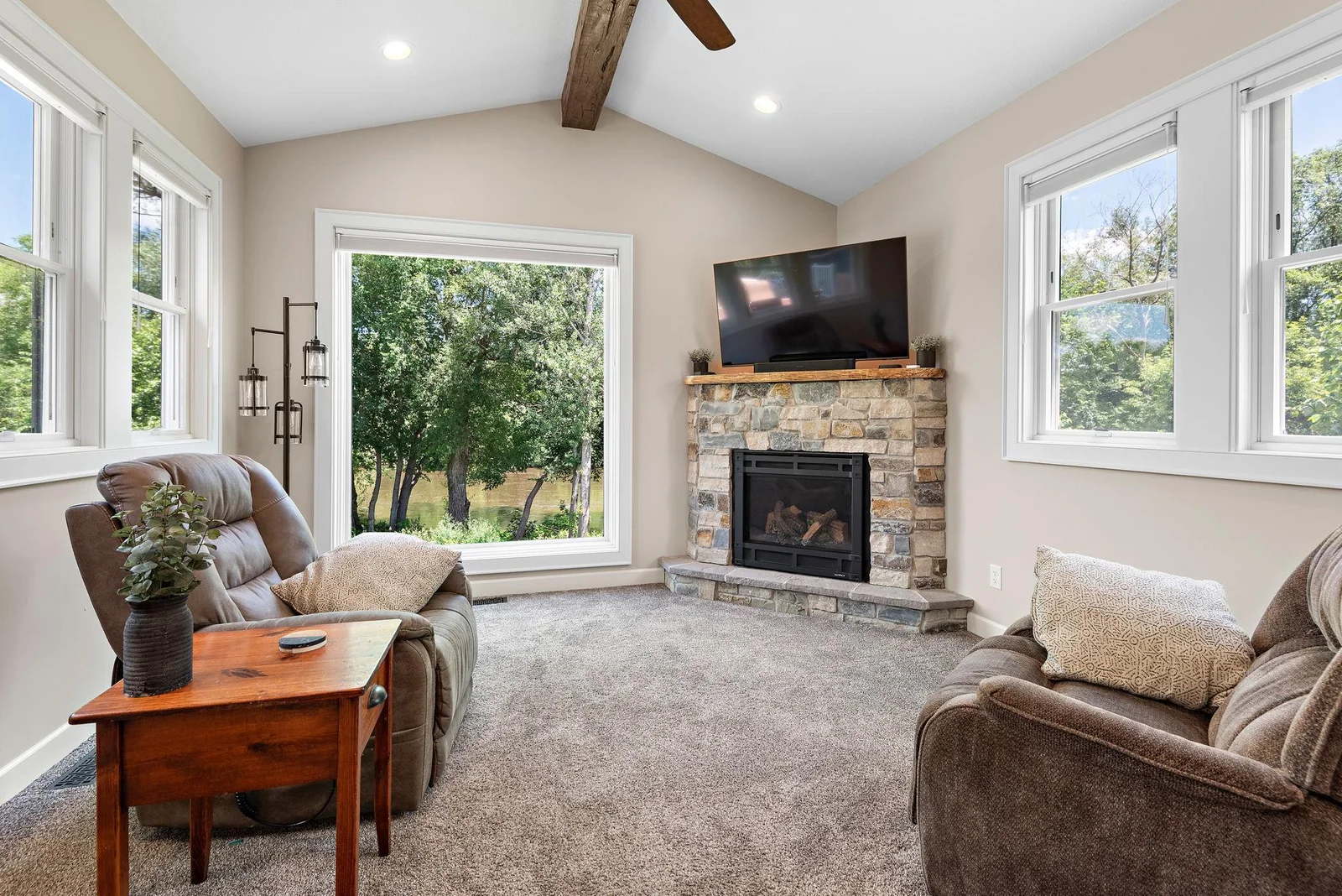 Enjoy your New Sun Room addition with a gas fireplace, vaulted ceilings and beautiful River Views!
