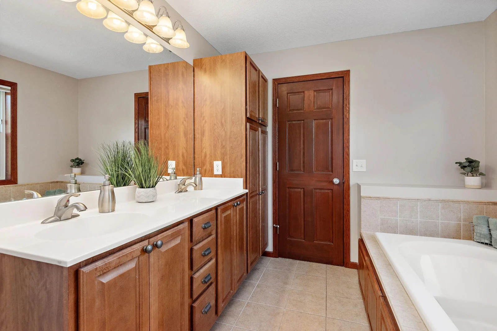 Primary/Owners Suite with huge walk-in closet, jetted tub, separate shower, tile floors and double vanity sink!