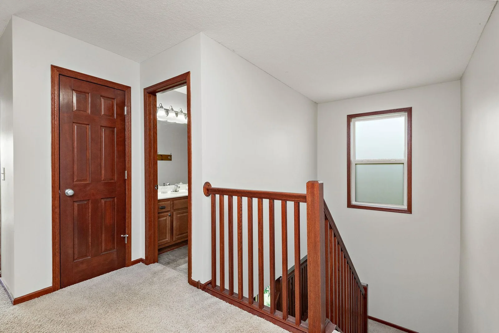 Upper Level Open Staircase freshly painted throughout!