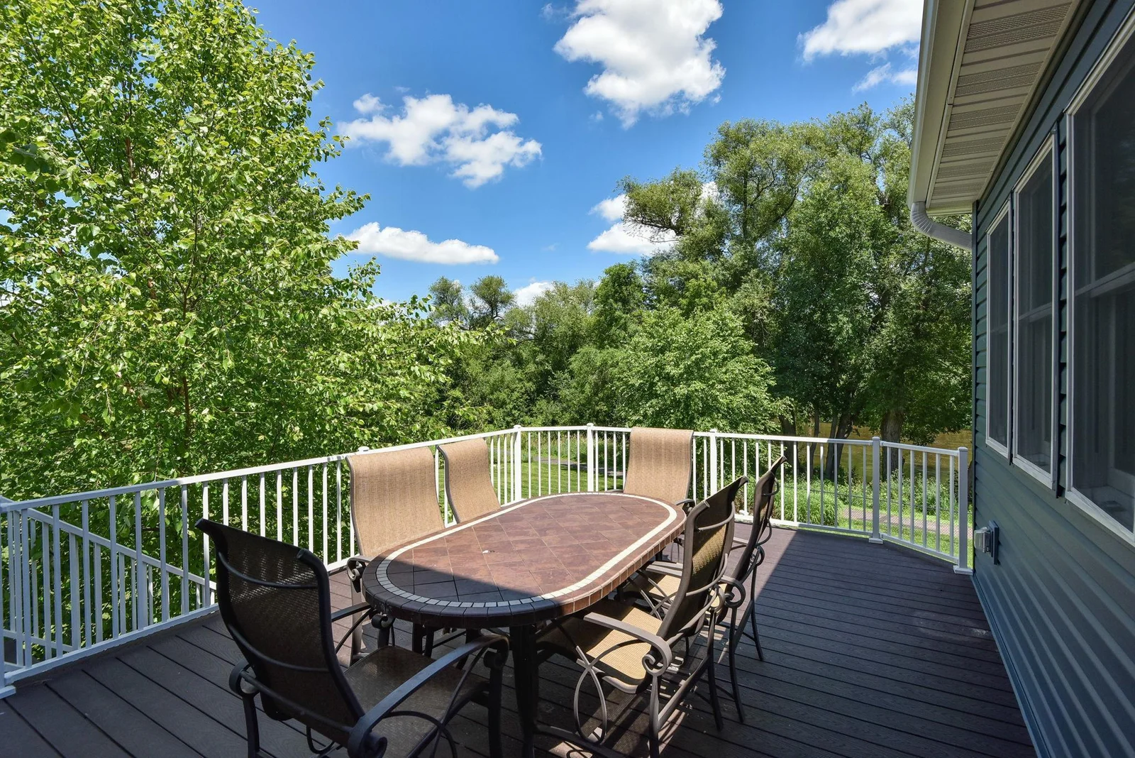 Large maintenance-free deck with more River Views and stairs to back yard!