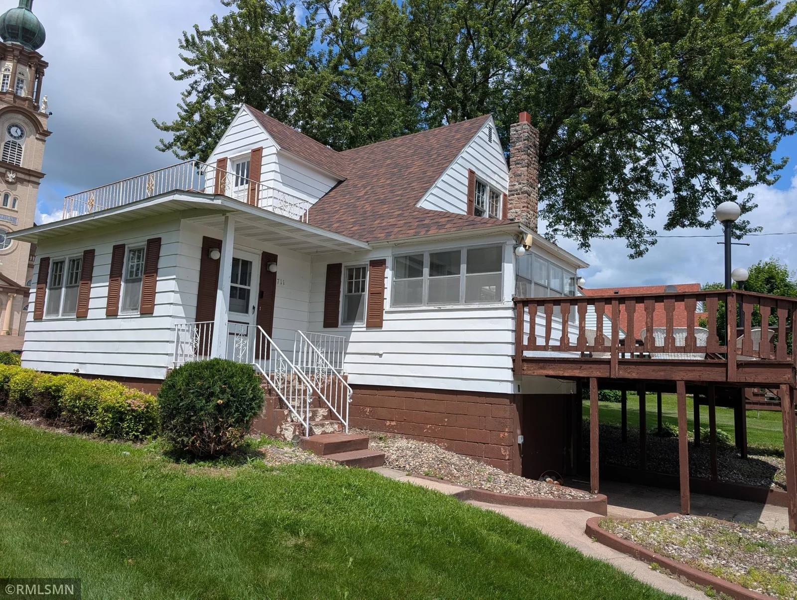 Back entrance, deck and tuck under garage