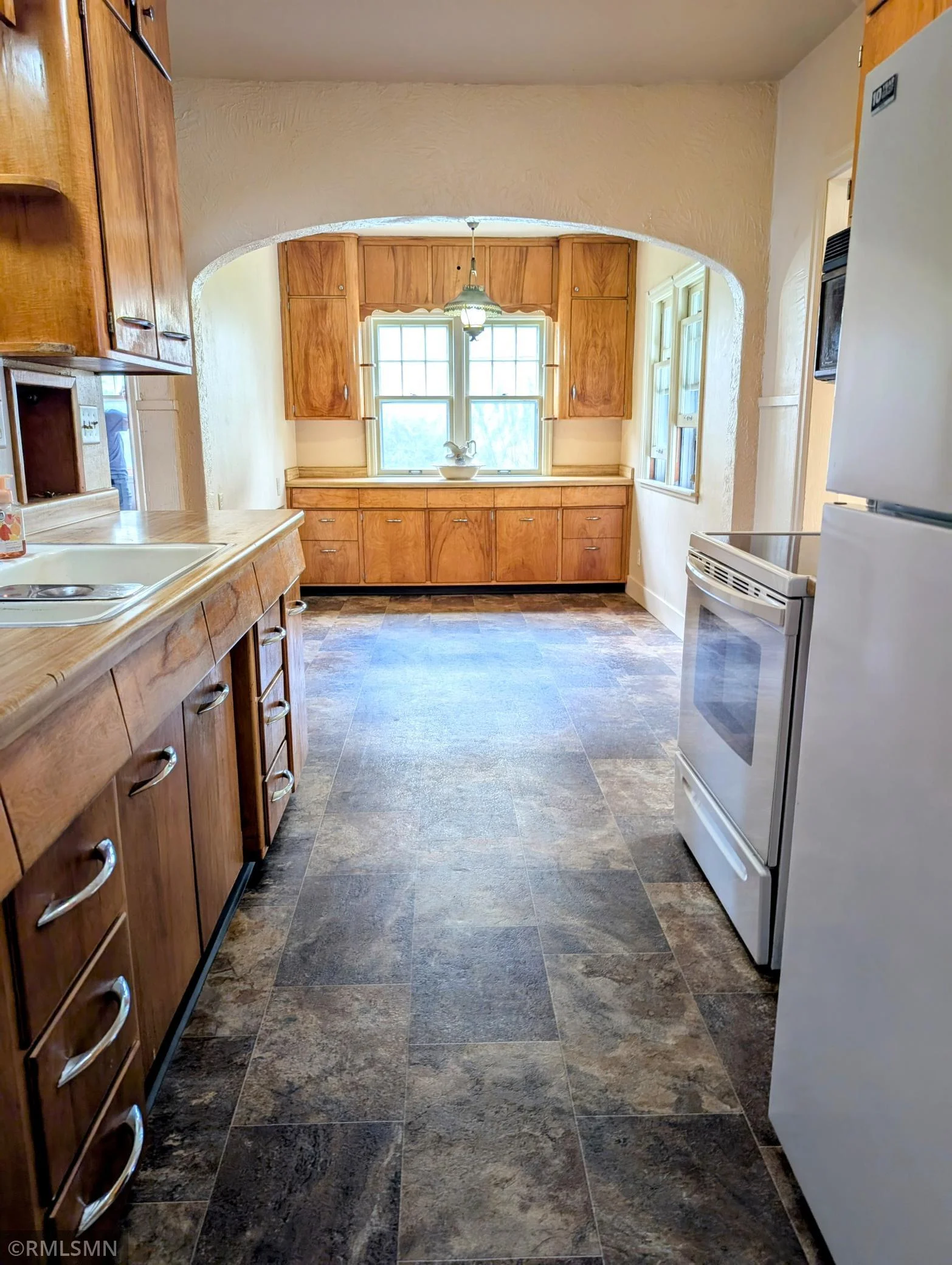 Galley kitchen and breakfast nook with storage