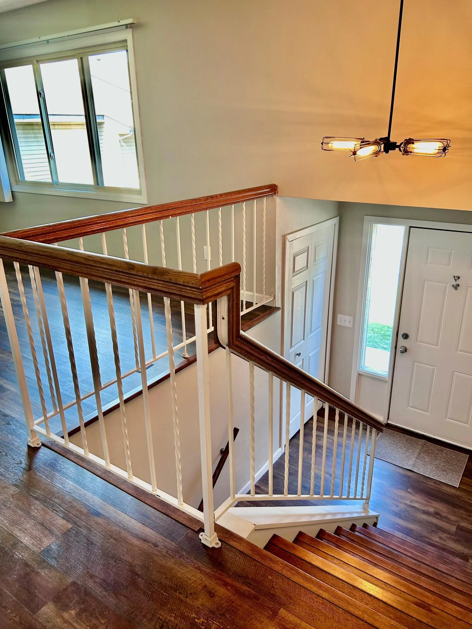 Stair view of entry and coat closet