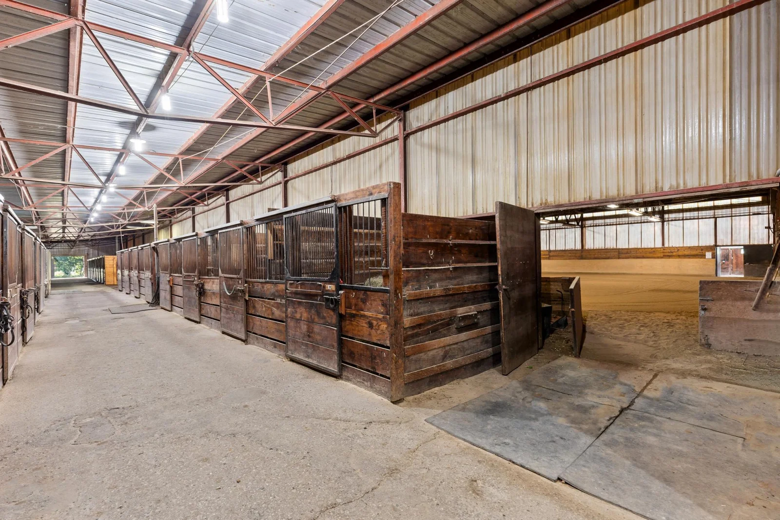 North Stall Aisle: access to Indoor Arena - 34 stalls: 2 -10' x 15' and 32 -10' x 12'