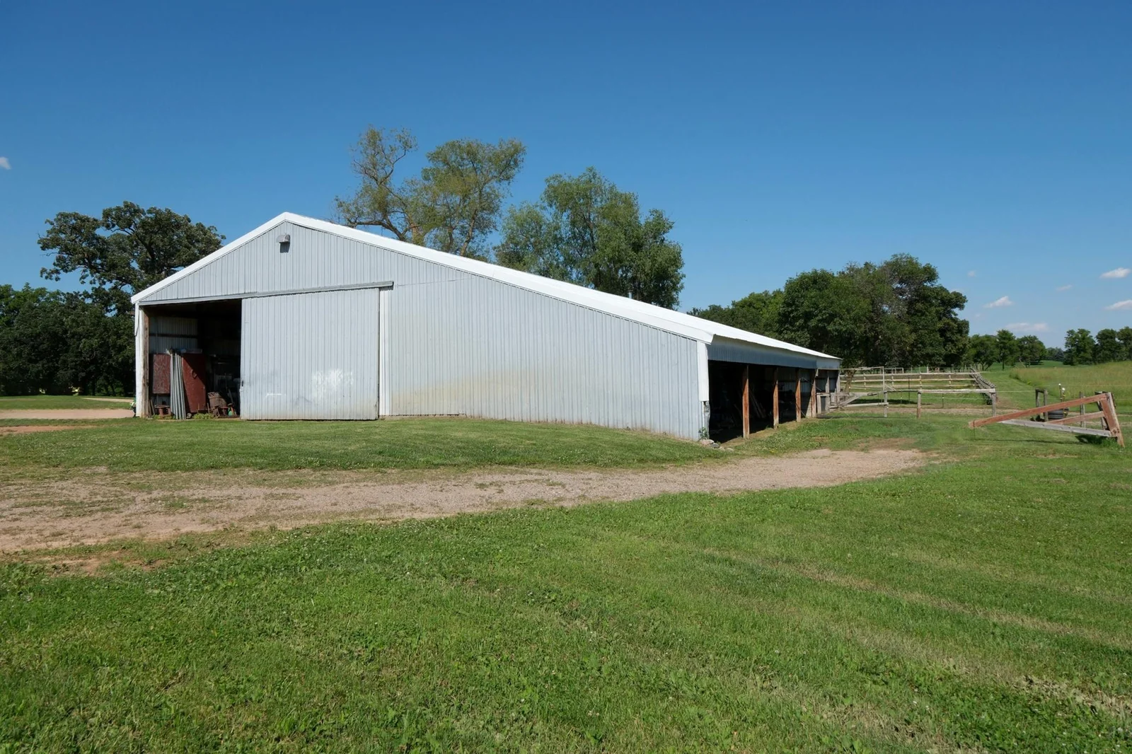 Farm Shed for Storage: 40' x 62' - storage area (32' x 40')  with dirt floor - 30' x 40' heated shop area with concrete floor - south end open to pasture