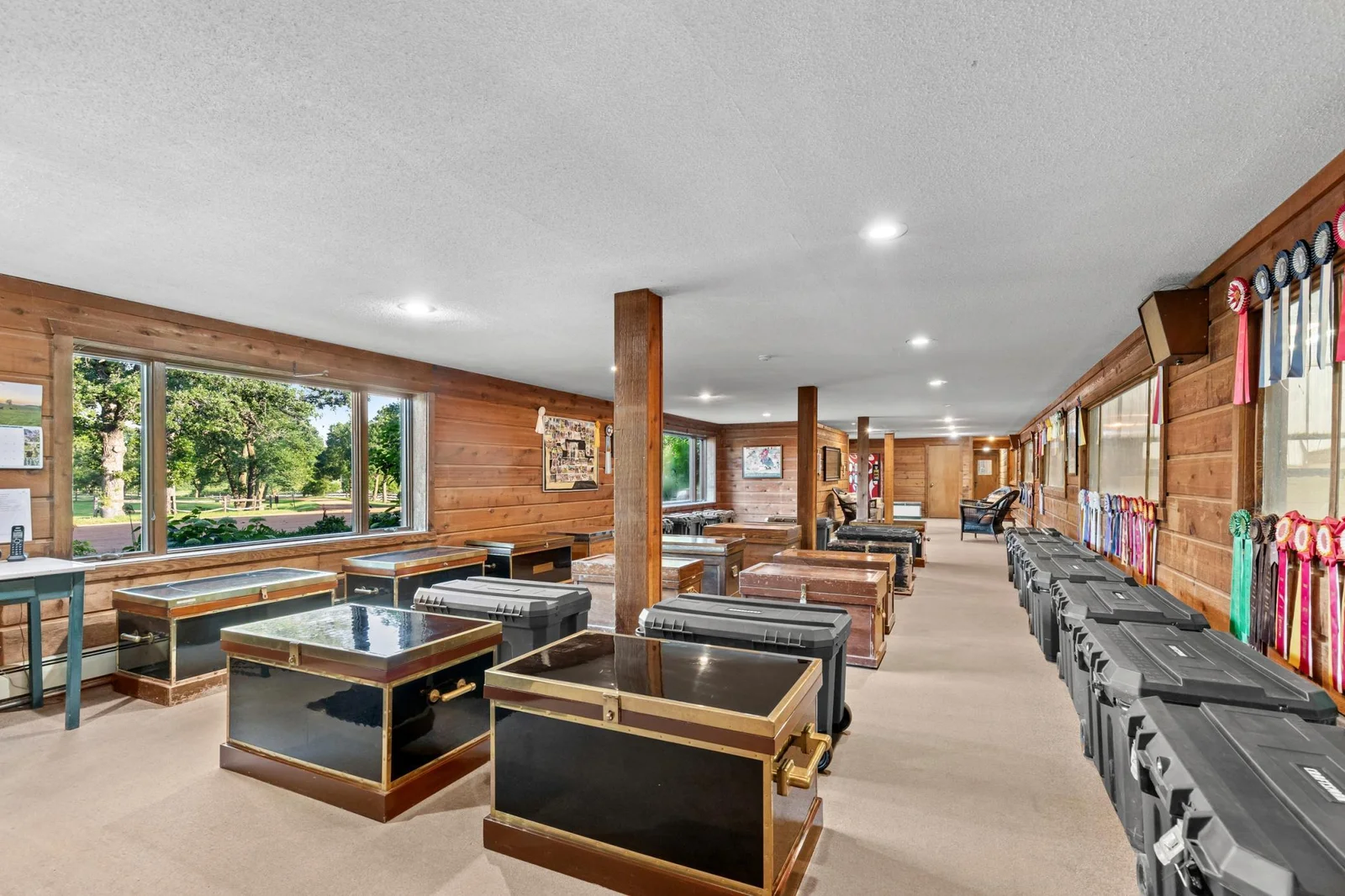 Main level lounge 19' x 65' and trunk storage - views into the Indoor Arena. Access to two bathrooms (men's and women's) and access to both South and North aisles and tack room
