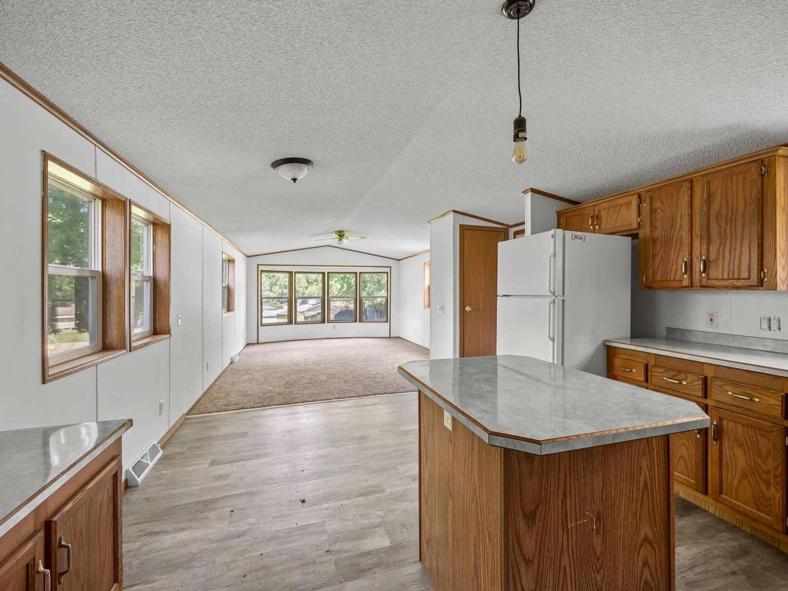 This home has had many updates in the last 2 years including new interior paint, sprayed ceilings, LVT flooring, carpet, water softener, and central air.