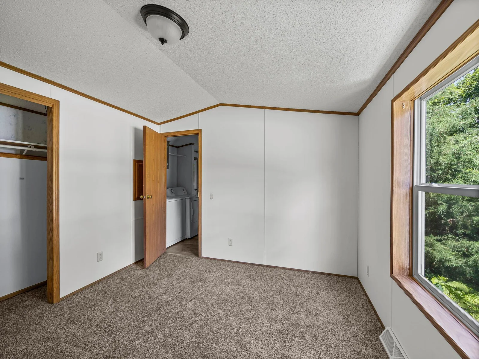 Another view of the primary bedroom.