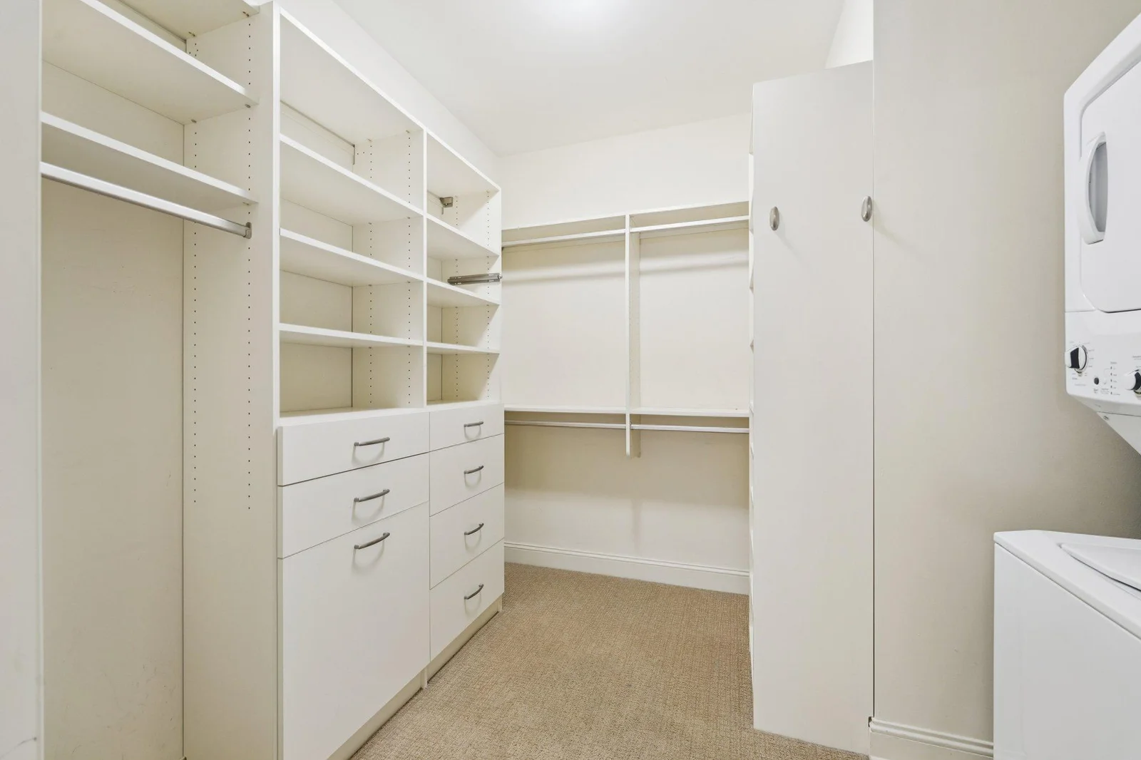 Walk in closet in primary bedroom