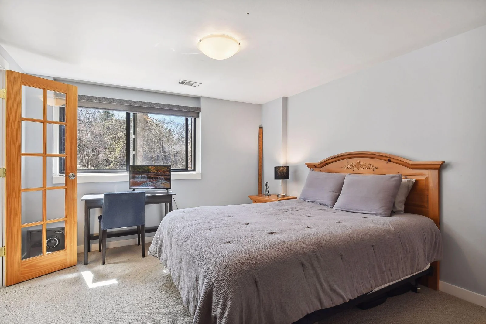 The home's 5th bedroom is found on the lower level; could also be used for a private home office space or exercise room