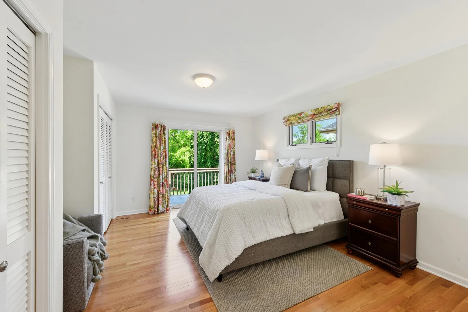 Primary bedroom with three closets and a private ensuite