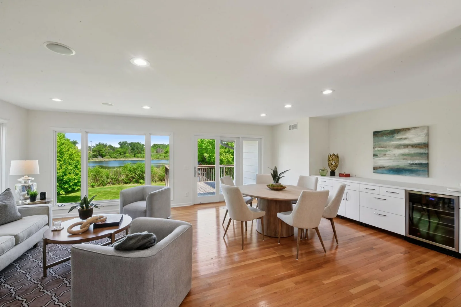 Open concept living dining room with beautiful views of Pamela Pond.