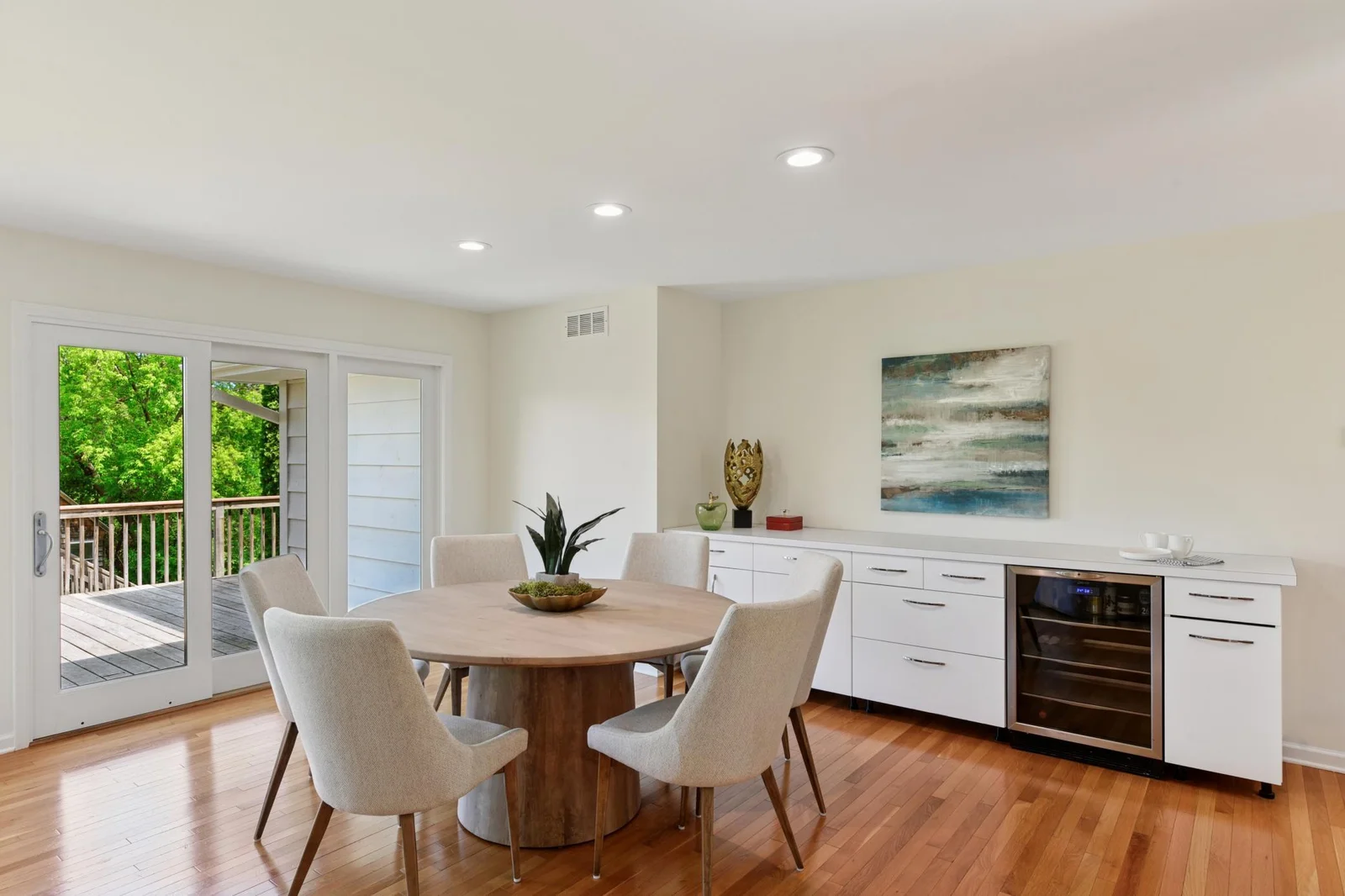 Open concept dining includes a built in buffet and mini fridge