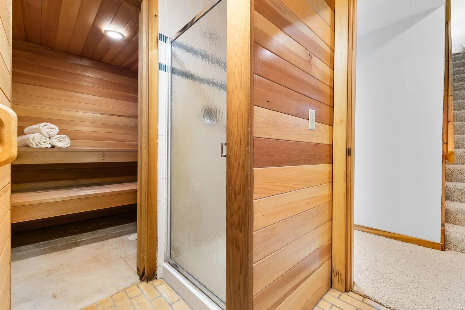 Indoor sauna with attached shower & dressing room