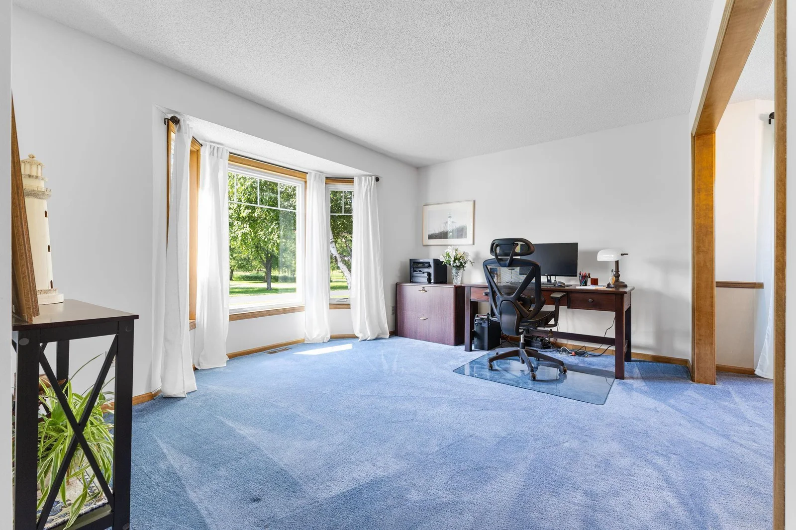The front room makes a great home office space or formal living room