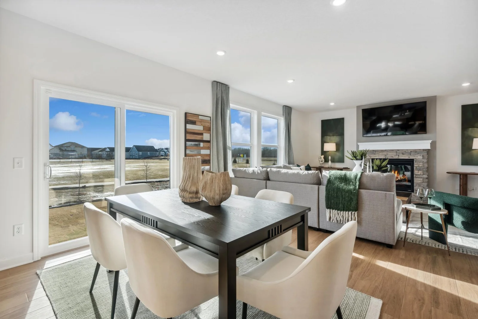 (Photo of decorated model, actual homes finishes will vary) Soaked in natural sunlight, the homes eat-in dining room has ample space for a dining table located in the heart of the home.