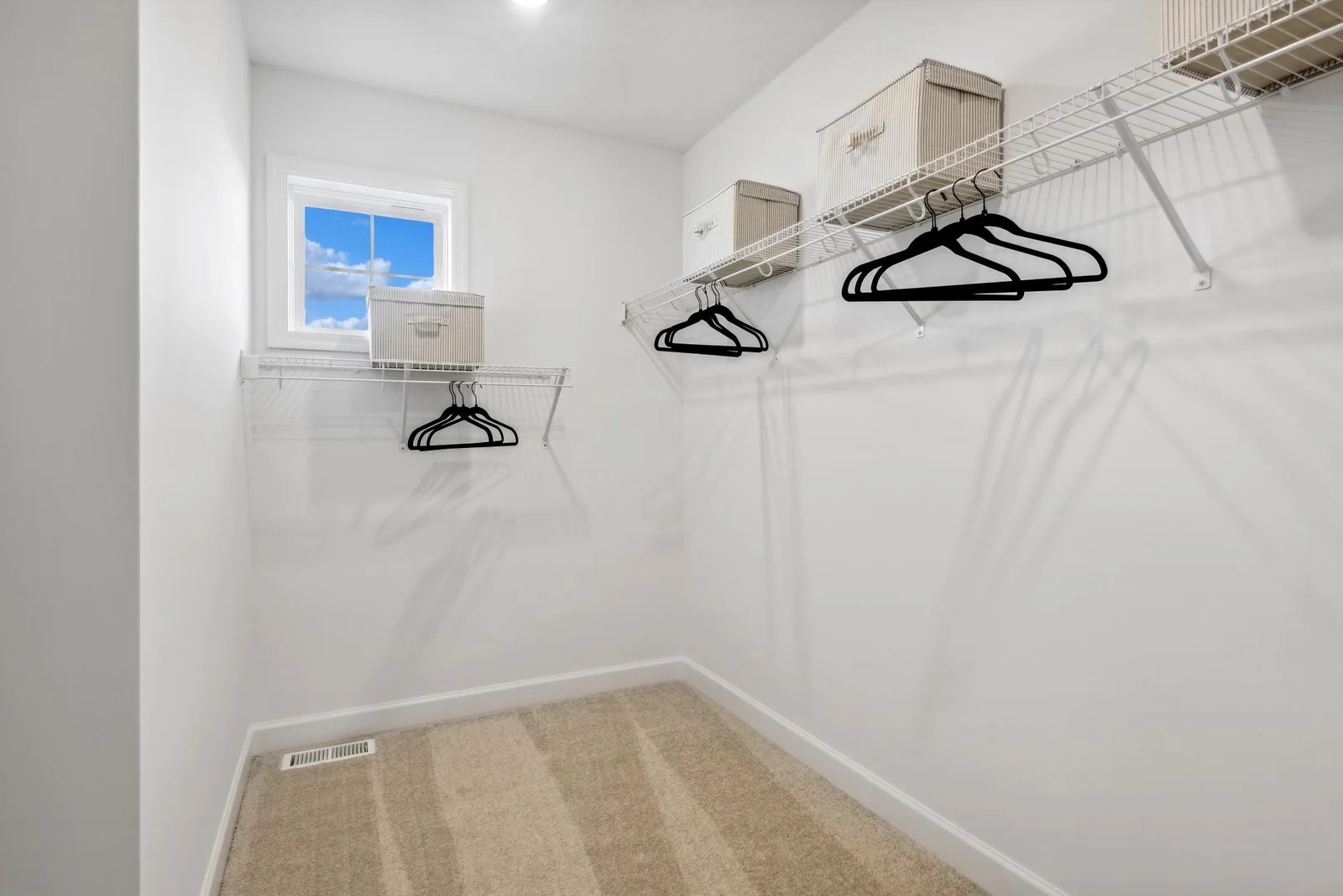 (Photo of decorated model, actual homes finishes will vary) The primary bedroom features a walk-in closet.