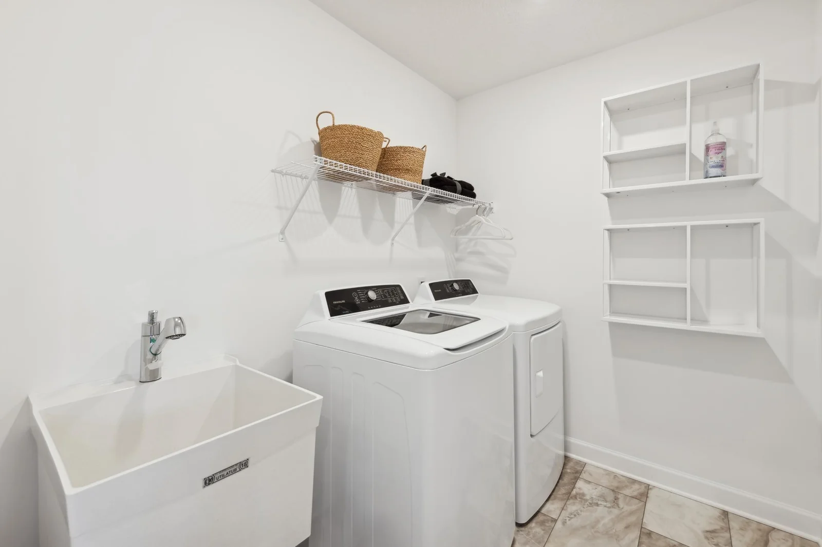 (Photo of decorated model, actual homes finishes will vary) Upper level laundry room is set up for a gas dryer. Note: appliances are not included.