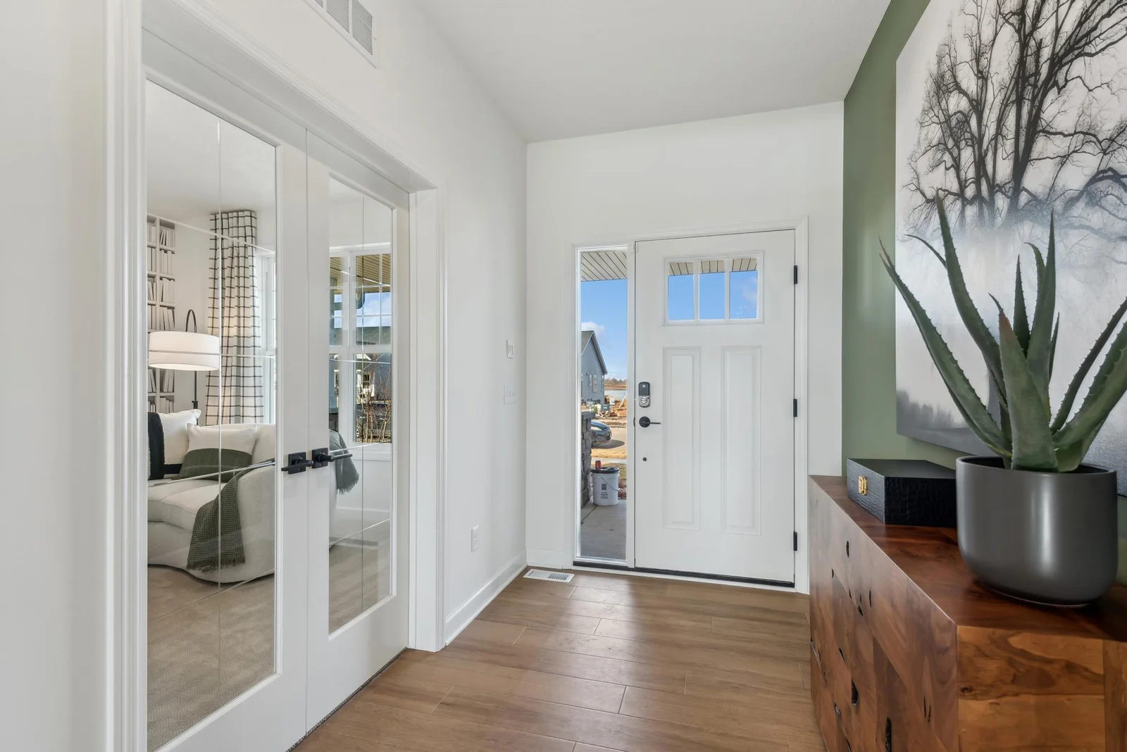 (Photo of decorated model, actual homes finishes will vary) Inviting and spacious entry is perfect for glam décor!