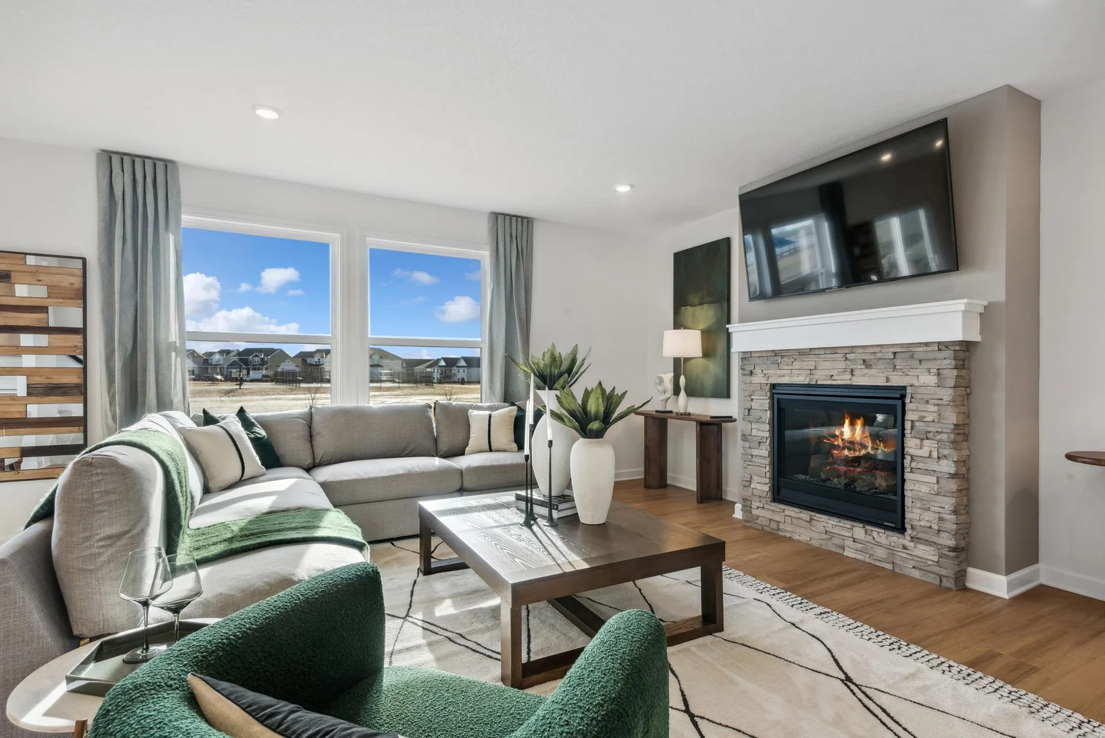 (Photo of decorated model, actual homes finishes will vary) Multiple furniture arrangements are possible in this beautiful great room.