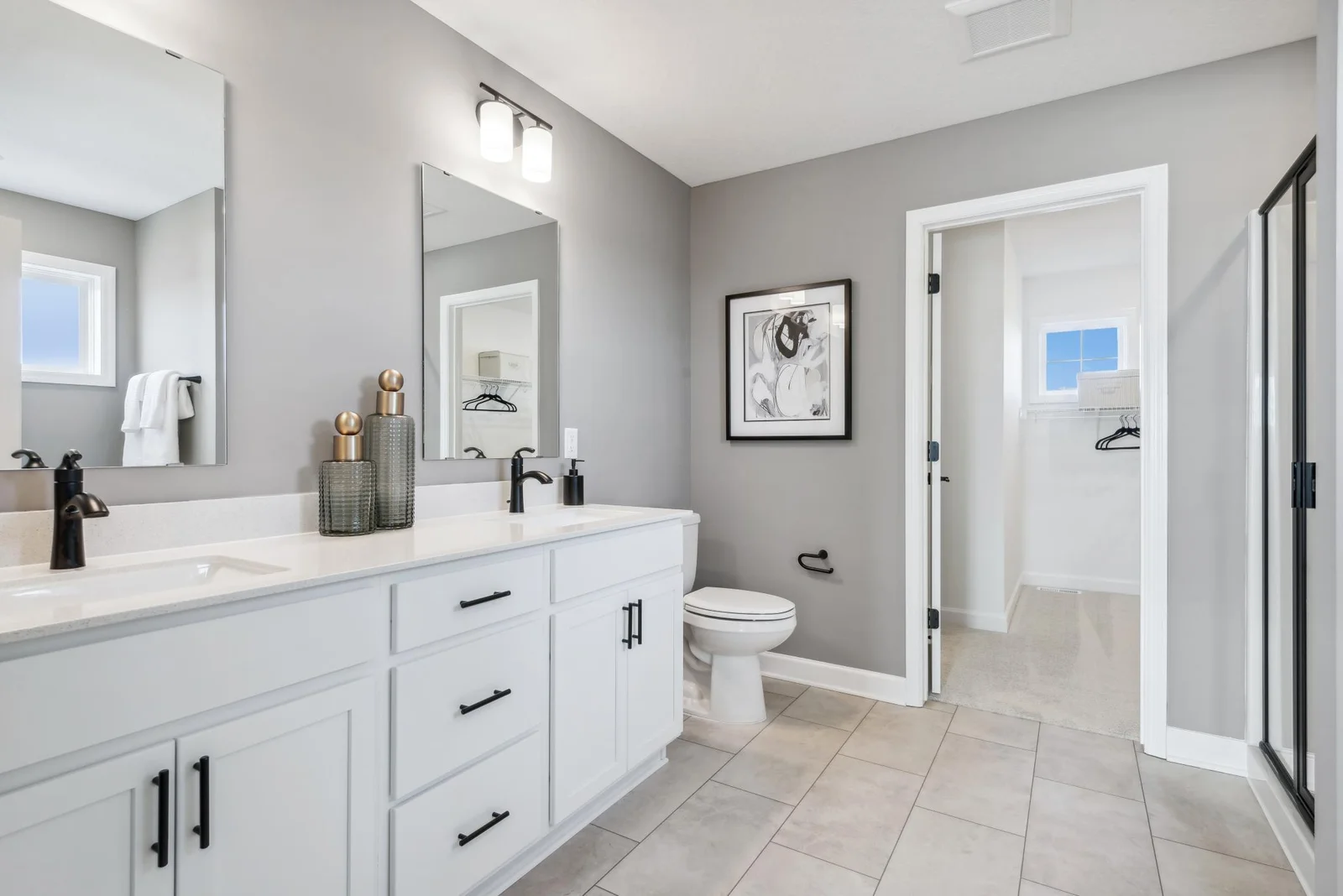 (Photo of decorated model, actual homes finishes will vary) Both tub and separate shower are included in the primary bath.