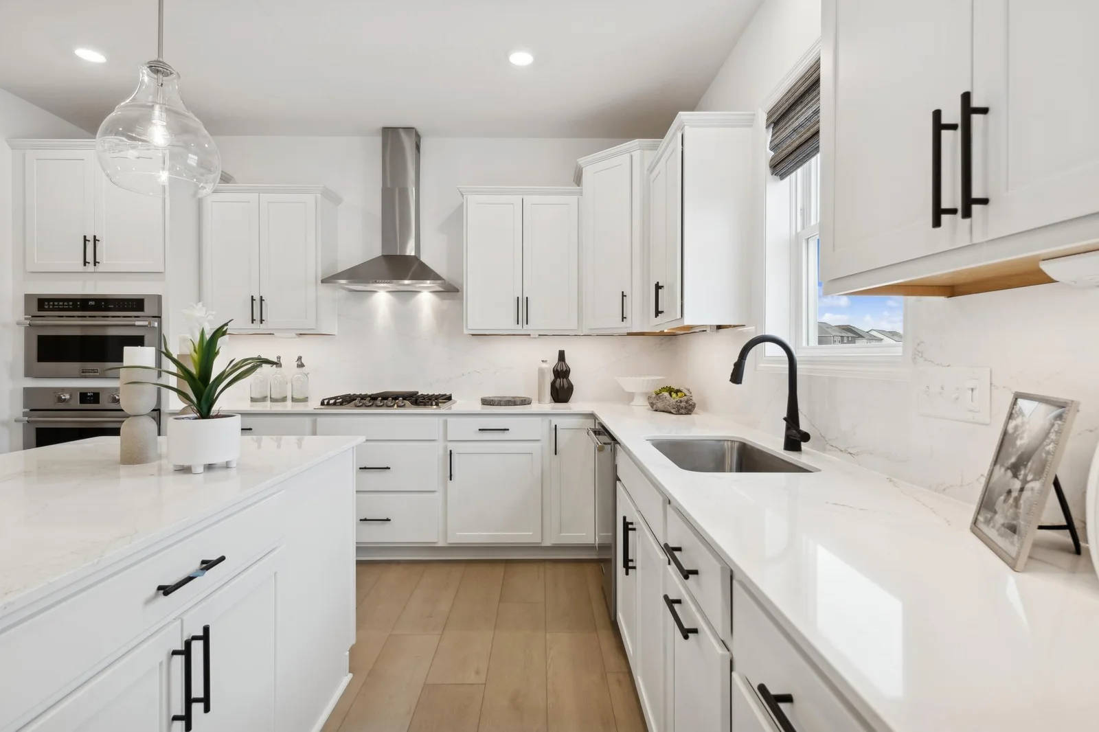 (Photo of decorated model, actual homes finishes will vary) Another view of the gourmet kitchen.