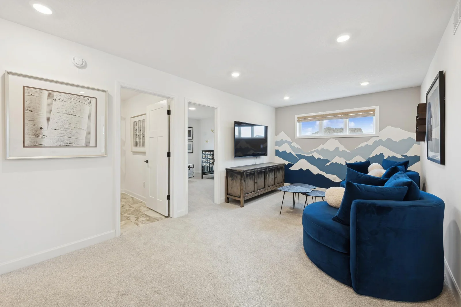 (Photo of decorated model, actual homes finishes will vary) Well-lit upper level loft doubles as a second family room.