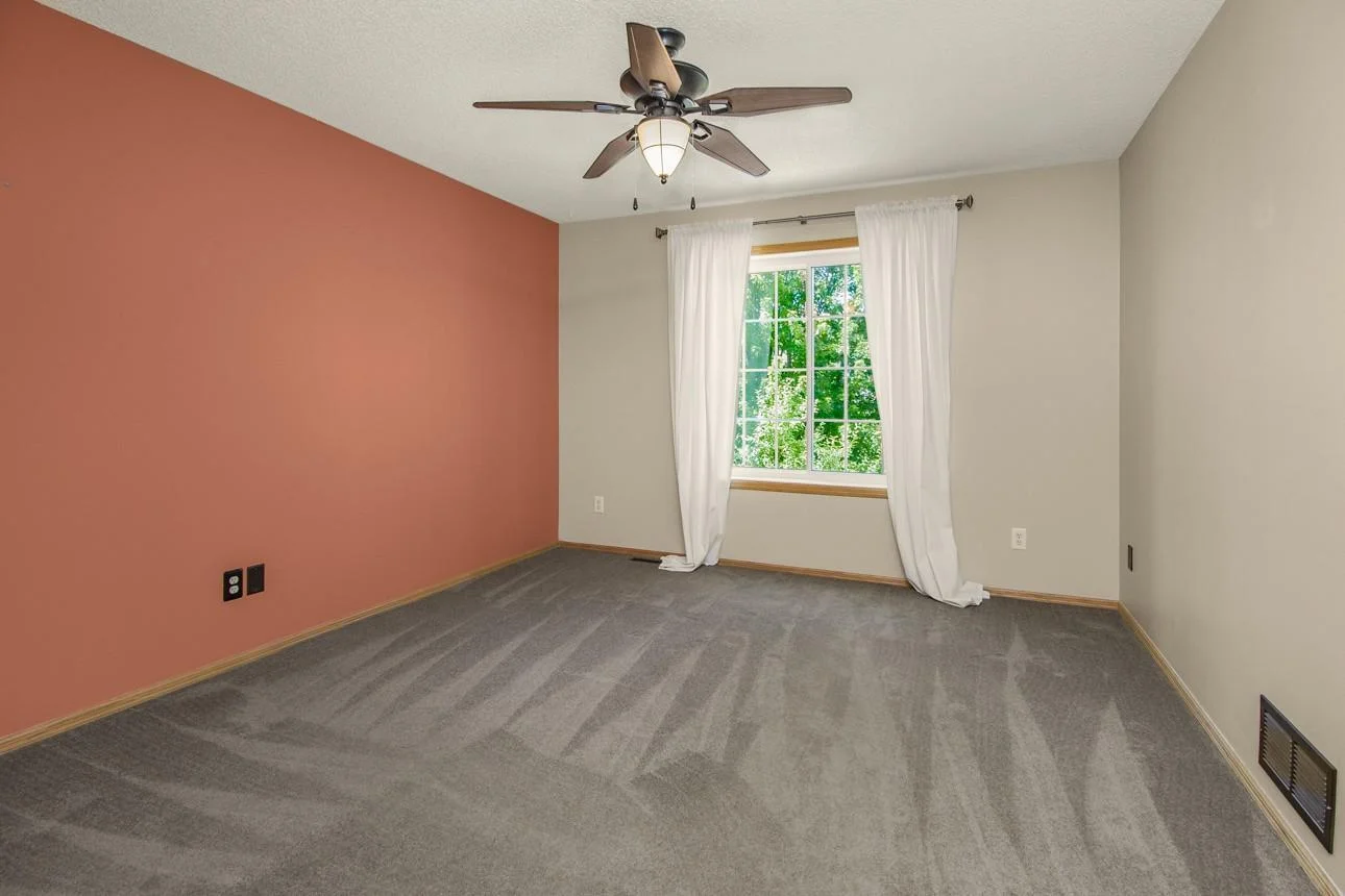 Primary Bedroom w/newly installed ceiling fan