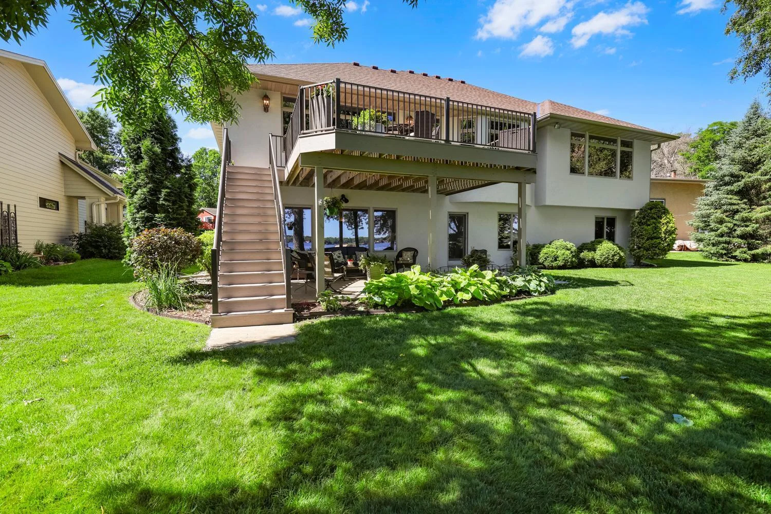 New deck is maintenance free with powder coated railing, and oversized with concrete patio below